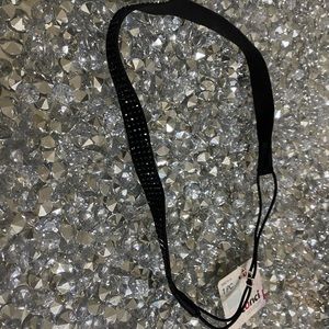 Thin black rhinestone Scunci headband.